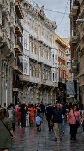 Busy street with ornate buildings rising up on either side