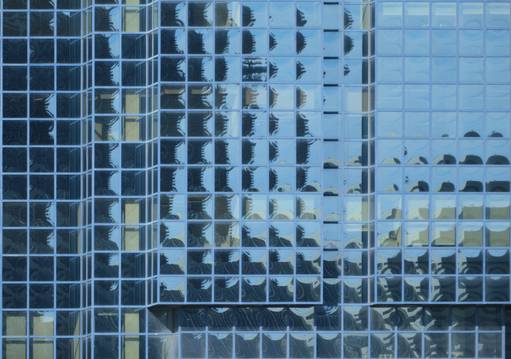 Light reflecting off the windows of a skyscraper