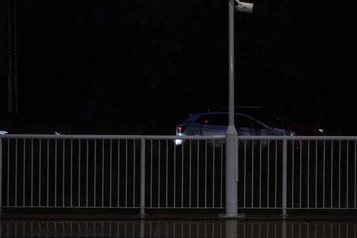 Fence reflected on a wet ground