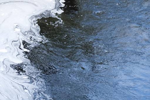 Foaming water from a river