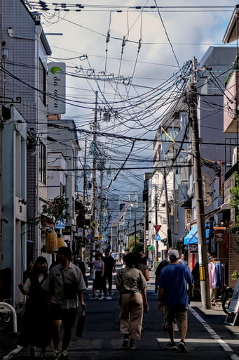 Busy street with dozens of cables overhead